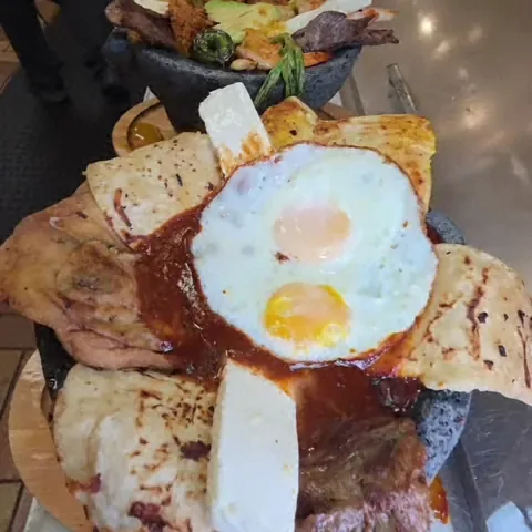 Molcajete de mole with a fried egg at Camacho's Restaurant
