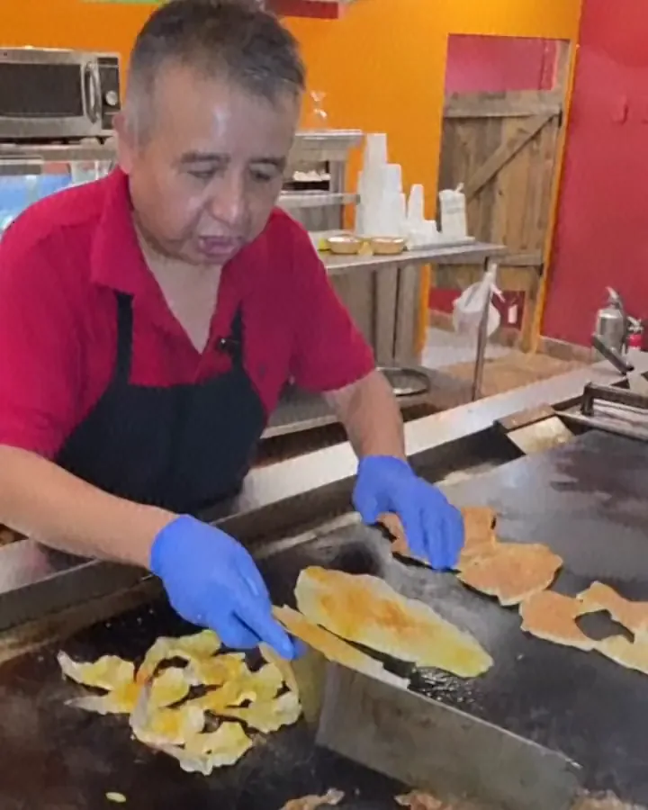 At the griddle in Camacho's kitchen: steak and fish fillets